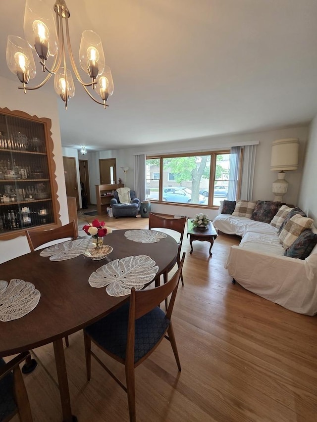 6124 W Berteau Ave, Chicago, IL 60634 - dining area with a chandelier and light wood finished floors