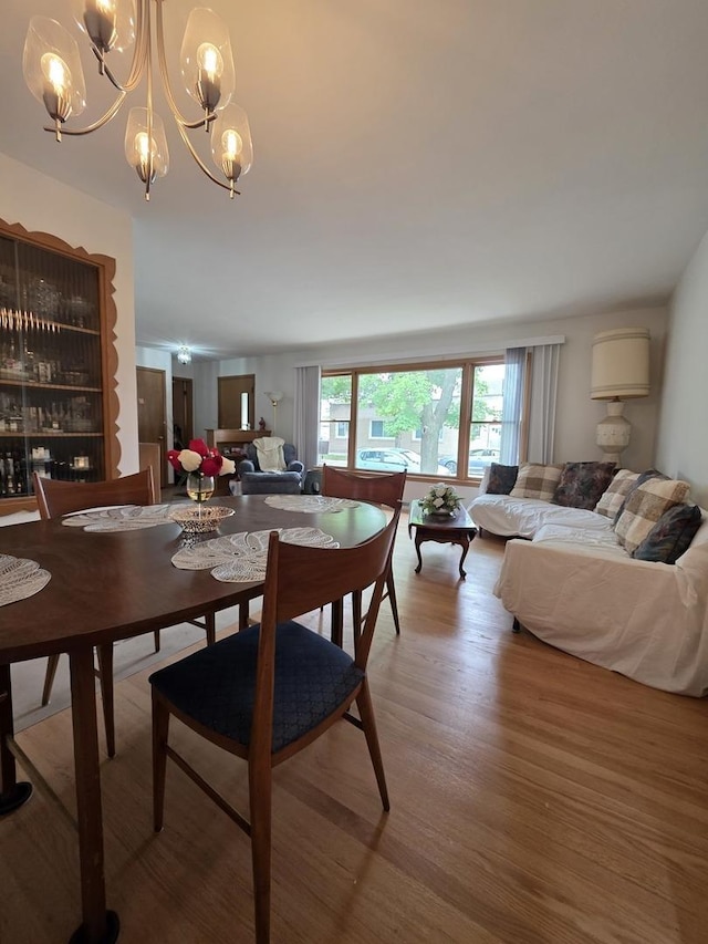 6124 W Berteau Ave, Chicago, IL 60634 - dining space featuring a chandelier and wood finished floors