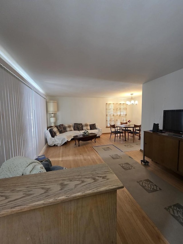 6124 W Berteau Ave, Chicago, IL 60634 - living room featuring a chandelier and wood finished floors