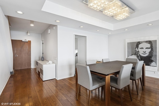 1100 N Lake Shore Dr Unit 33A, Chicago, IL 60611 - dining room with a chandelier, dark wood finished floors, recessed lighting, a raised ceiling, and baseboards