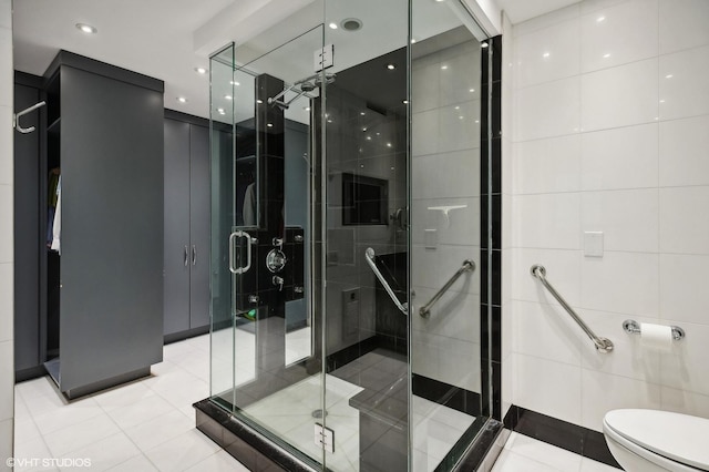 1100 N Lake Shore Dr Unit 33A, Chicago, IL 60611 - bathroom with toilet, a stall shower, tile walls, and tile patterned flooring