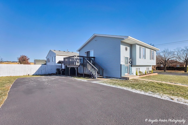 1802 11, Waukegan, IL 60085 - view of side of property featuring stairway and a deck