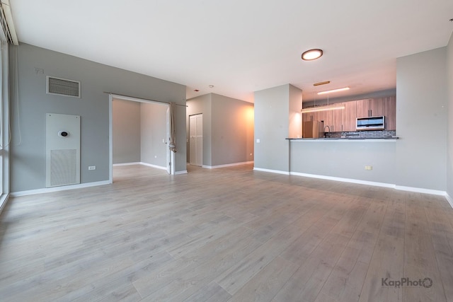 757 N Orleans St Unit 1104, Chicago, IL 60654 - unfurnished living room featuring light wood-type flooring and baseboards