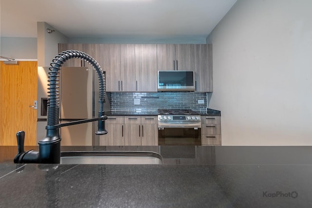 757 N Orleans St Unit 1104, Chicago, IL 60654 - kitchen with appliances with stainless steel finishes, a sink, modern cabinets, and tasteful backsplash