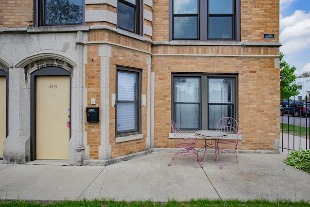 3441 W Grace St Unit G, Chicago, IL 60618 - entrance to property with brick siding and a patio