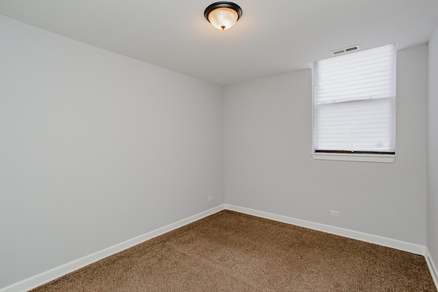 3441 W Grace St Unit G, Chicago, IL 60618 - unfurnished room with dark colored carpet and baseboards