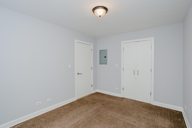 3441 W Grace St Unit G, Chicago, IL 60618 - unfurnished bedroom with carpet floors, electric panel, baseboards, and a closet