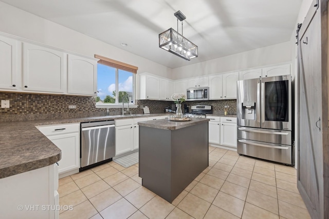 25338 Scott Dr, Plainfield, IL 60544 - kitchen with stainless steel appliances, a sink, dark countertops, tasteful backsplash, and white cabinets