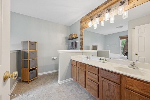 25338 Scott Dr, Plainfield, IL 60544 - full bathroom with double vanity and baseboards