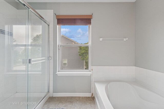 25338 Scott Dr, Plainfield, IL 60544 - bathroom featuring a bath, a stall shower, baseboards, and tile patterned flooring