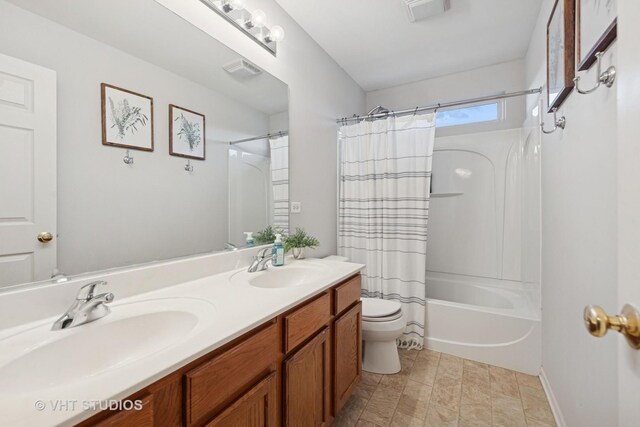 25338 Scott Dr, Plainfield, IL 60544 - bathroom featuring double vanity, toilet, and shower / tub combo