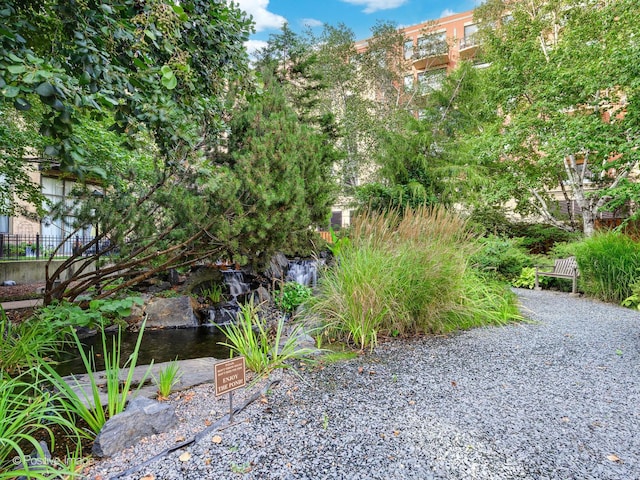 1301 W Madison St Unit 402, Chicago, IL 60607 - view of yard featuring a garden pond
