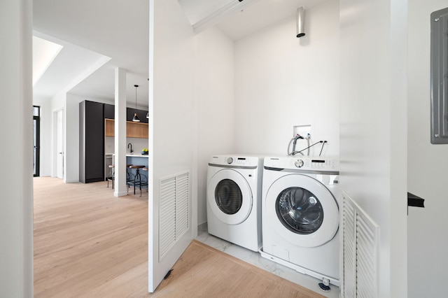2354 W Farragut Ave Unit Ph-404, Chicago, IL 60625 - laundry area with separate washer and dryer and light wood-style floors