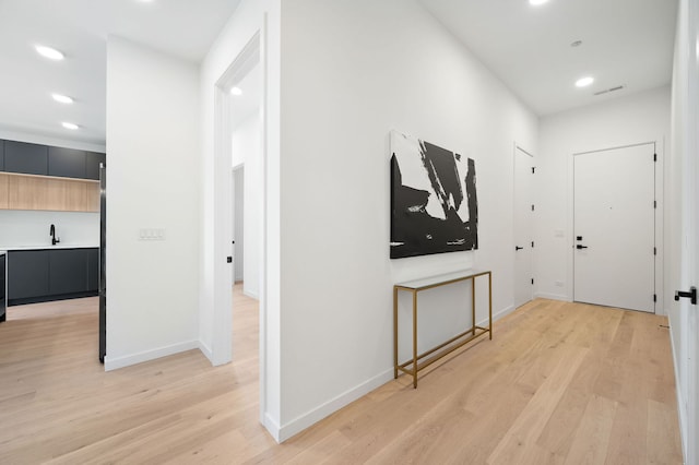 2354 W Farragut Ave Unit Ph-404, Chicago, IL 60625 - corridor with light wood-style flooring, recessed lighting, baseboards, and a sink