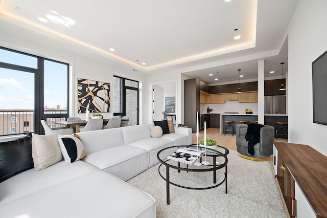 2354 W Farragut Ave Unit Ph-404, Chicago, IL 60625 - living room featuring recessed lighting, light wood finished floors, and a tray ceiling
