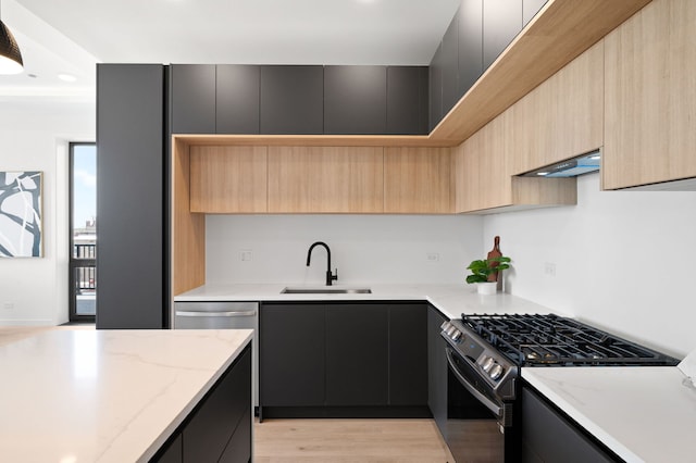 2354 W Farragut Ave Unit Ph-404, Chicago, IL 60625 - kitchen featuring stainless steel gas range oven, modern cabinets, a sink, and under cabinet range hood