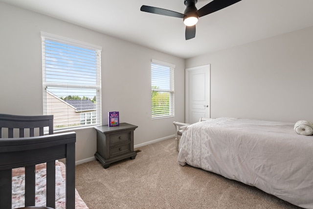 2615 Camden St, Geneva, IL 60134 - bedroom with light colored carpet, baseboards, and a ceiling fan