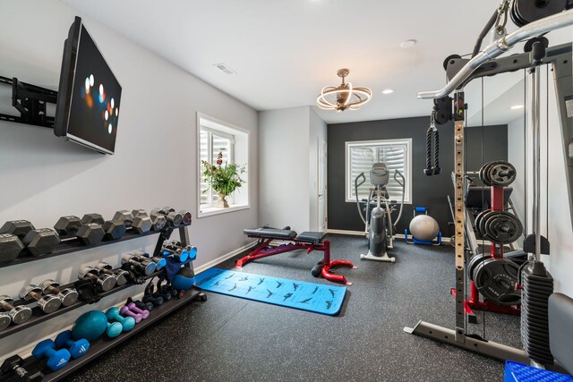 2615 Camden St, Geneva, IL 60134 - workout area with a chandelier, baseboards, and recessed lighting