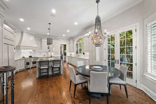 494 Greenleaf Ave, Glencoe, IL 60022 - dining room featuring crown molding, a chandelier, dark wood-style floors, recessed lighting, and french doors