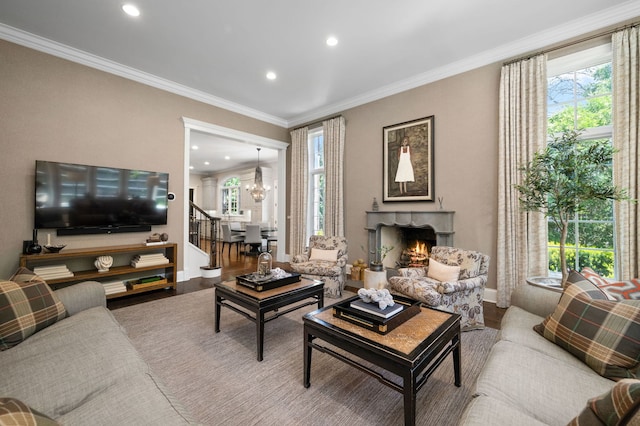 494 Greenleaf Ave, Glencoe, IL 60022 - living area with a chandelier, plenty of natural light, a warm lit fireplace, recessed lighting, and stairway