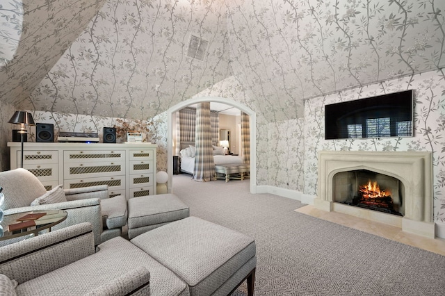 494 Greenleaf Ave, Glencoe, IL 60022 - living area with wallpapered walls, carpet flooring, baseboards, a fireplace with flush hearth, and arched walkways