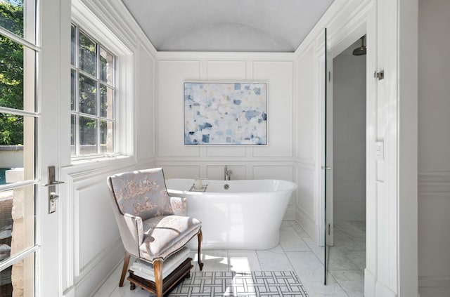 494 Greenleaf Ave, Glencoe, IL 60022 - full bath featuring a freestanding bath, a decorative wall, vaulted ceiling, and marble finish flooring