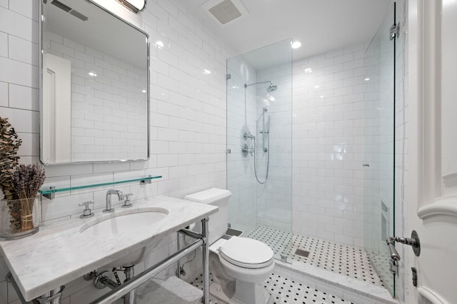 494 Greenleaf Ave, Glencoe, IL 60022 - bathroom with a sink, tile walls, toilet, a tile shower, and decorative backsplash