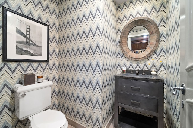 494 Greenleaf Ave, Glencoe, IL 60022 - bathroom with toilet, wallpapered walls, baseboards, vanity, and an accent wall