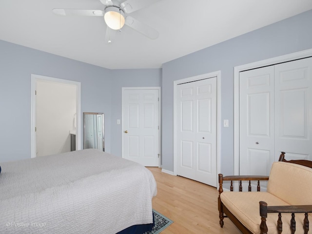 840 N Wood St Unit 2, Chicago, IL 60622 - bedroom with two closets, light wood finished floors, and ceiling fan