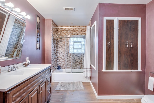 2105 Caton Farm Rd, Crest Hill, IL 60403 - bathroom featuring vanity, wood finished floors, and shower / tub combination