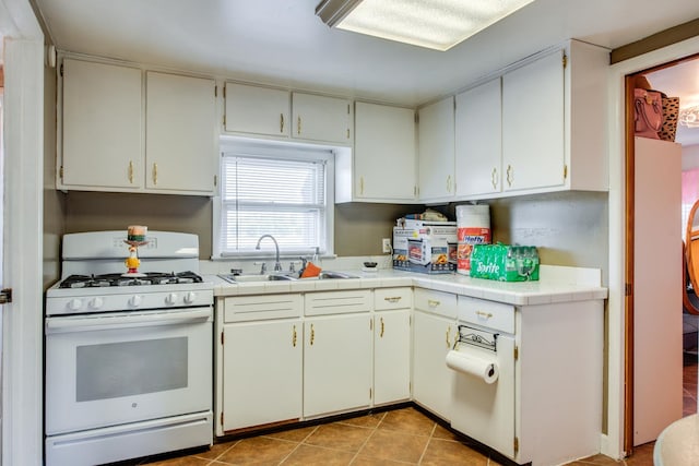 2105 Caton Farm Rd, Crest Hill, IL 60403 - kitchen with white gas range and light tile patterned floors