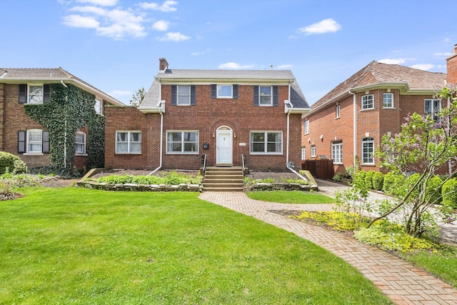 230 N Wisner St, Park Ridge, IL 60068 - view of front of house featuring a chimney, a front lawn, and brick siding