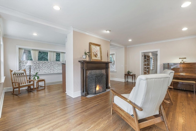230 N Wisner St, Park Ridge, IL 60068 - sitting room with wood finished floors, a fireplace with flush hearth, plenty of natural light, recessed lighting, and ornamental molding