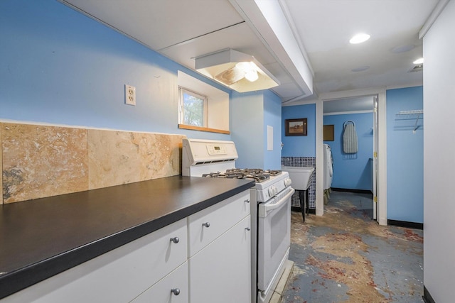 230 N Wisner St, Park Ridge, IL 60068 - kitchen with gas range gas stove, dark countertops, unfinished concrete flooring, and white cabinets