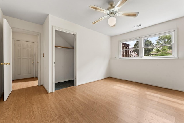 169 S Ellyn Ave, Glen Ellyn, IL 60137 - unfurnished bedroom featuring light wood-type flooring, a closet, and a ceiling fan