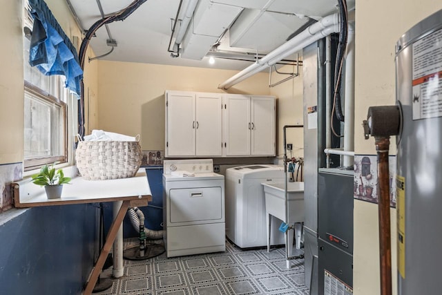 169 S Ellyn Ave, Glen Ellyn, IL 60137 - washroom featuring cabinet space, washer and dryer, water heater, and tile patterned floors