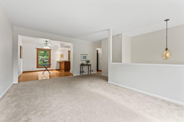169 S Ellyn Ave, Glen Ellyn, IL 60137 - unfurnished living room with carpet flooring and a ceiling fan