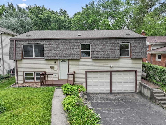 169 S Ellyn Ave, Glen Ellyn, IL 60137 - colonial inspired home with an attached garage, roof with shingles, driveway, and a front yard