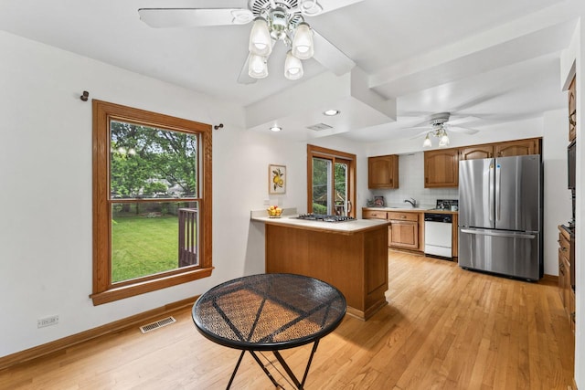 169 S Ellyn Ave, Glen Ellyn, IL 60137 - kitchen with freestanding refrigerator, white dishwasher, ceiling fan, light countertops, and light wood-type flooring