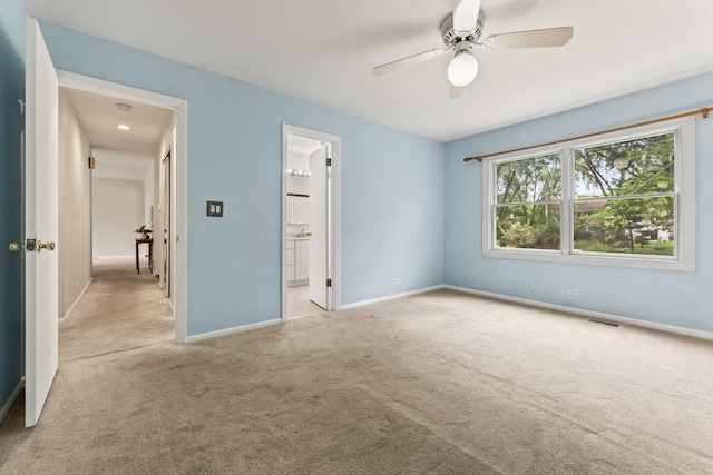 169 S Ellyn Ave, Glen Ellyn, IL 60137 - unfurnished bedroom with carpet floors, connected bathroom, and ceiling fan