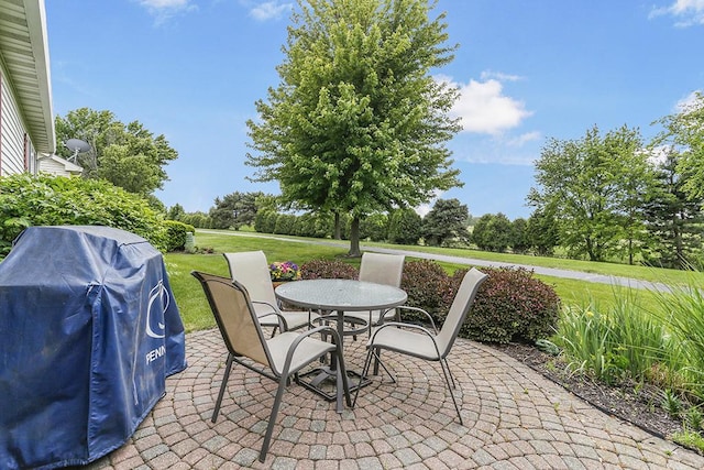 608 Bridgeman Ln, Romeoville, IL 60446 - view of patio / terrace featuring grilling area, outdoor dining space, and view of wooded area