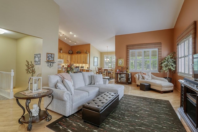 608 Bridgeman Ln, Romeoville, IL 60446 - living area featuring lofted ceiling and light wood-style flooring