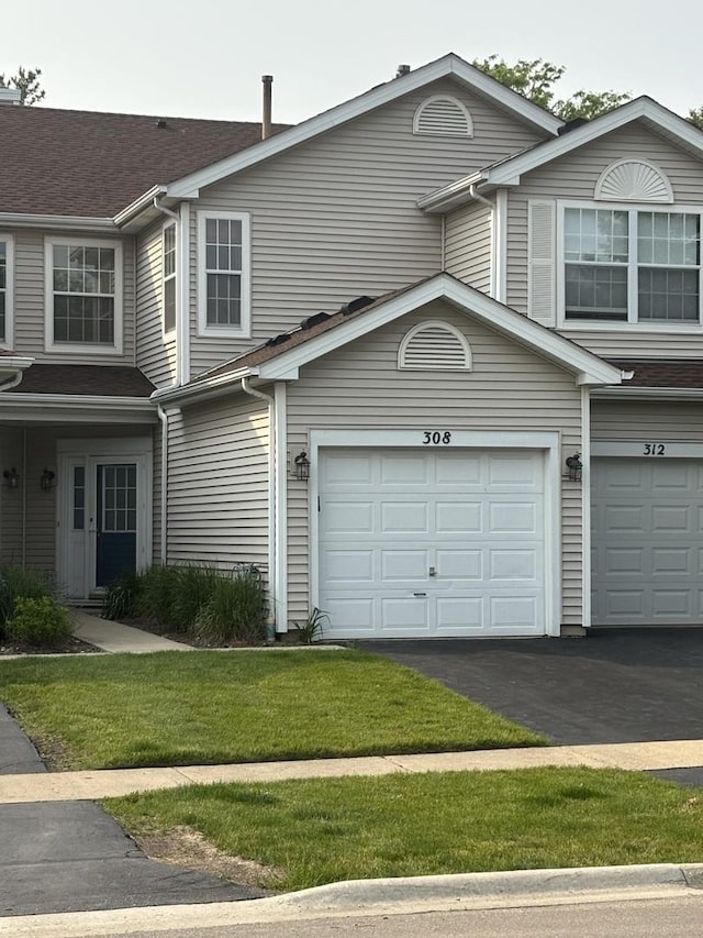 308 Glen Leven Ct Unit 308, Schaumburg, IL 60194 - view of front of home with driveway, an attached garage, and a front yard
