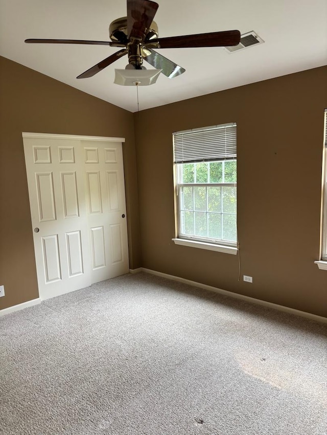 308 Glen Leven Ct Unit 308, Schaumburg, IL 60194 - unfurnished bedroom with carpet, vaulted ceiling, baseboards, a ceiling fan, and a closet