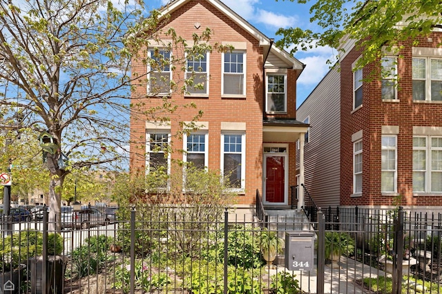 344 W Goethe Ave, Chicago, IL 60610 - traditional-style house with a fenced front yard and brick siding