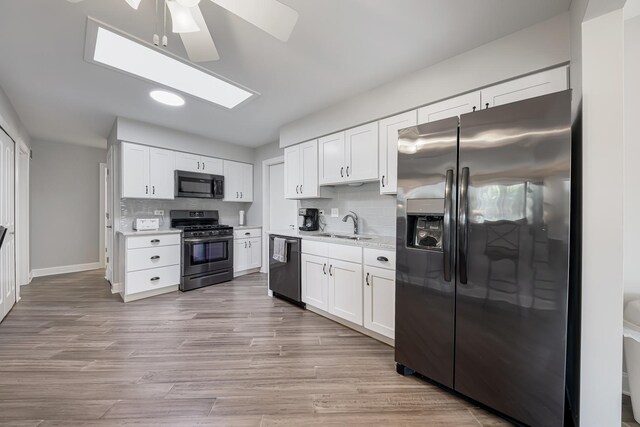 17828 Massachusetts Ct, Orland Park, IL 60467 - kitchen with appliances with stainless steel finishes, ceiling fan, a sink, white cabinets, and backsplash