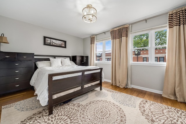 2720 N Greenview Ave Unit C, Chicago, IL 60614 - bedroom featuring wood finished floors, baseboards, and a chandelier