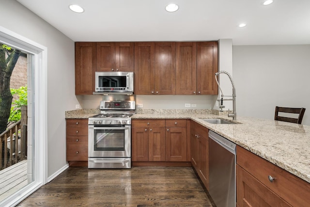 2720 N Greenview Ave Unit C, Chicago, IL 60614 - kitchen featuring appliances with stainless steel finishes, a sink, recessed lighting, light stone counters, and dark wood-style floors