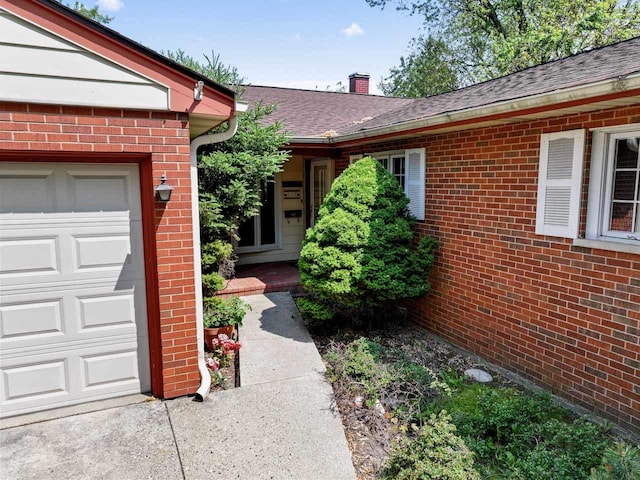 137 N Clark Dr, Palatine, IL 60074 - entrance to property with brick siding, a chimney, a garage, and a shingled roof