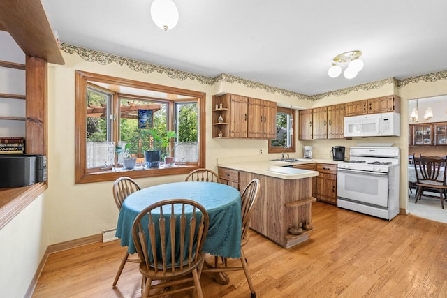 137 N Clark Dr, Palatine, IL 60074 - kitchen with white appliances, a peninsula, open shelves, light countertops, and light wood-style floors